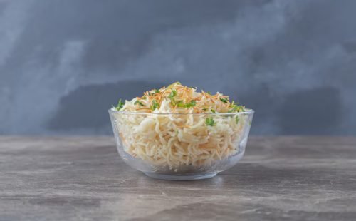 flavorful-vermicelli-pasta-with-green-vegetable-bowl-marble-surface_114579-63702