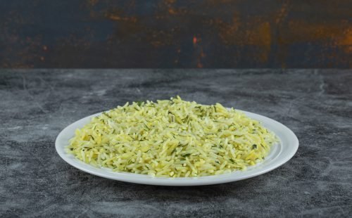 Plate of delicious rice on marble background. High quality photo