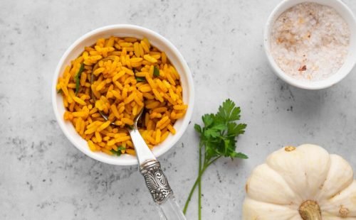 top-view-delicious-yellow-rice-bowl_23-2148728166